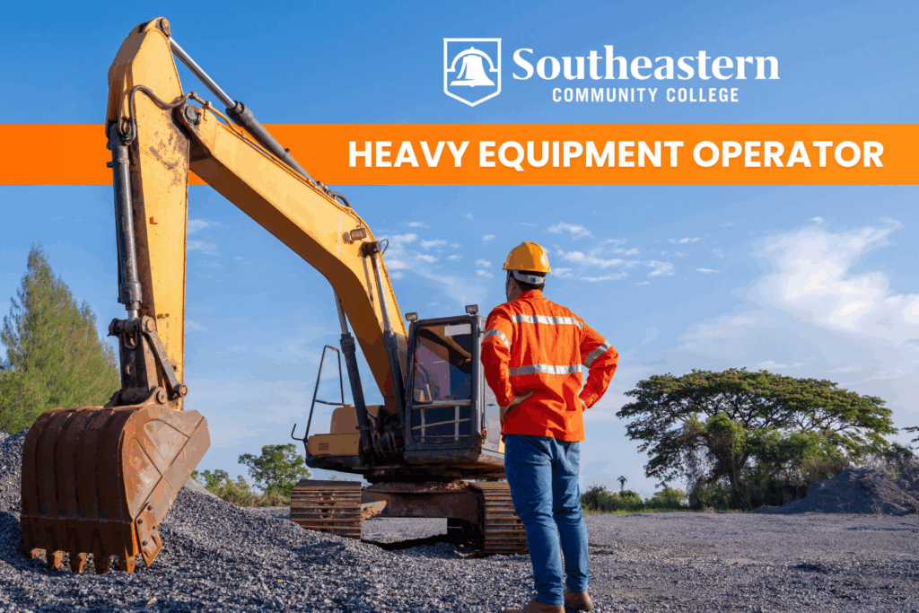 A man stands in front of heavy equipment.