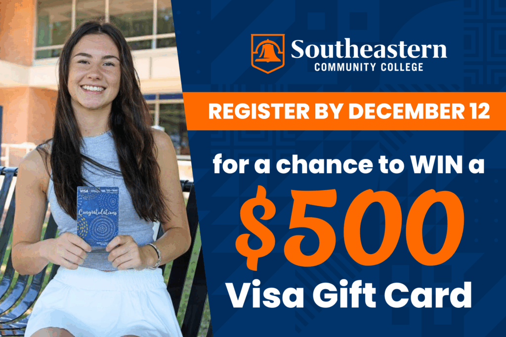 A student holds a $500 gift card