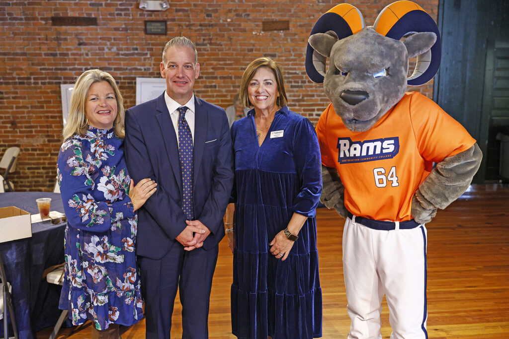 Rocco stands with SCC Foundation leadership at the luncheon.