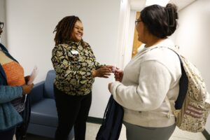 SCC CFO, Ibreta Jackson giving Walmart gift card to NCReconnect Student