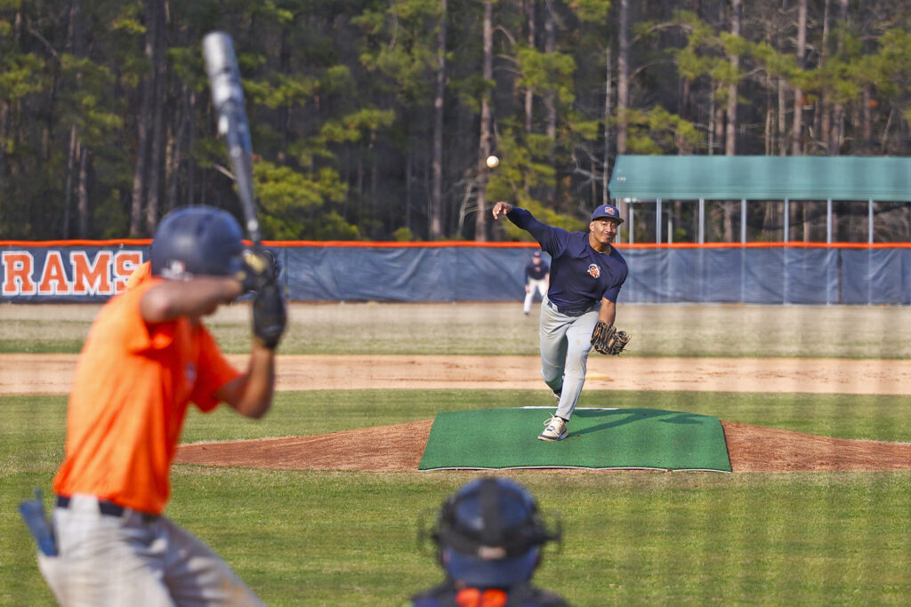 An SCC baseball player pitches during practice.