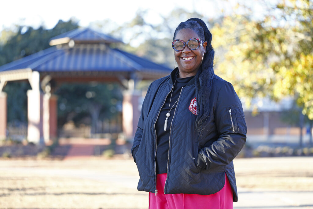 Veronica Powell stands in the middle of SCC's campus as the new Associate Dean of Transitional Studies and Prison Education.