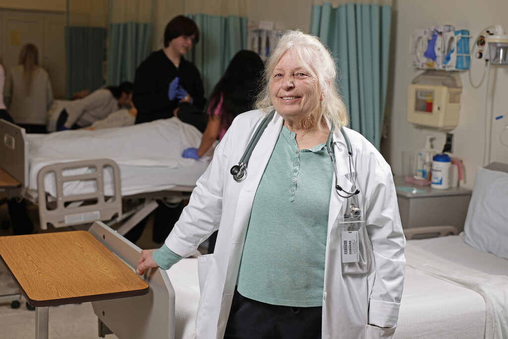 Kathy Price stands in her Nurse Aide I classroom as a new instructor and Program Coordinator of Nurse Aide I.