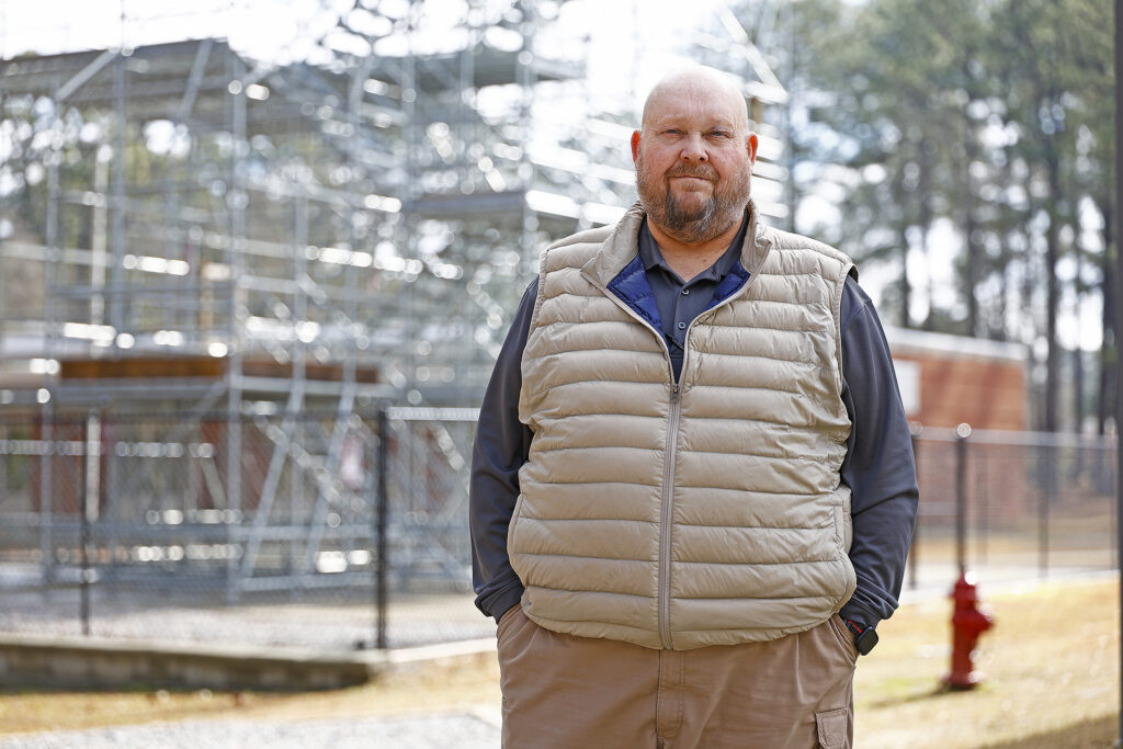 SCC's new associate dean of public safety Ronnie Hayes stands in front of the fire training tower on campus.