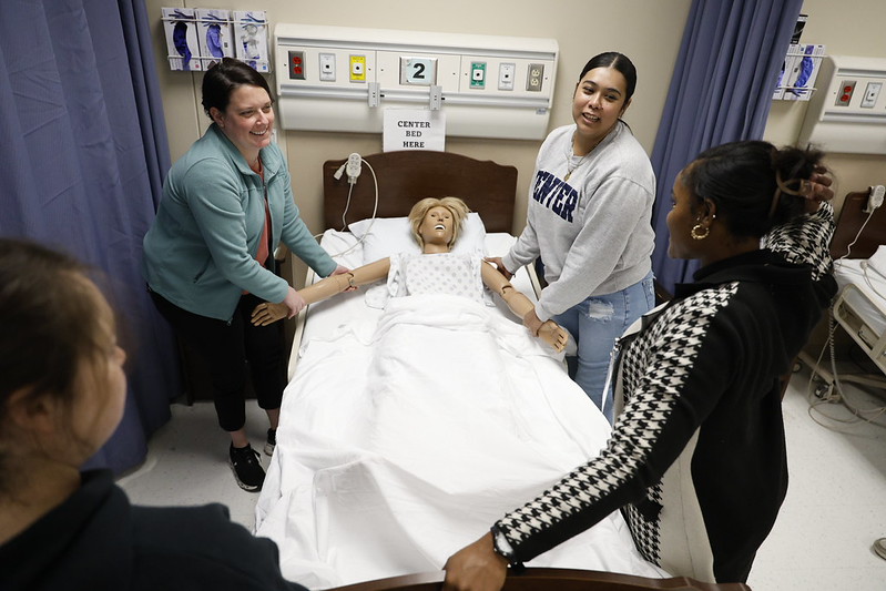 Student participate in hands-on activity in healthcare simulation lab