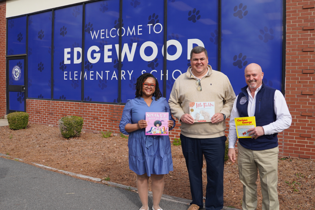 Dr. Chris English, SCC President, Dr. Brandon Jenkins, Executive Vice President and Chief Academic Officer, and Ibreta Jackson, Vice President of Administrative Services and Chief Operating Officer standing in front of Edgewood Elementary School for Read Across America.