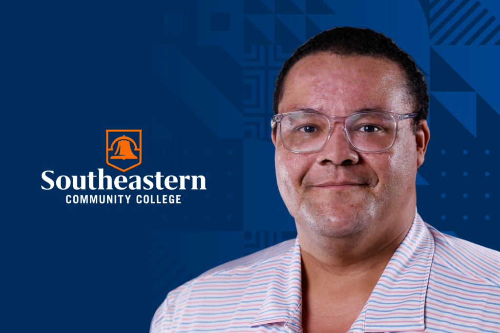 Headshot of Clif Young wearing glasses and a striped collared shirt on a blue Southeastern Community College branded background with the SCC logo.