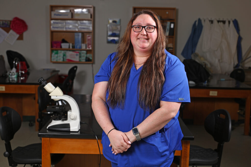 Cat Torelli stands inside the MLT lab at SCC.