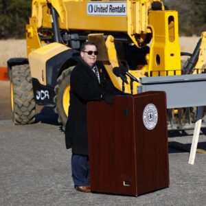 Representative Brenden Jones at STEM Signing speaking at a podium
