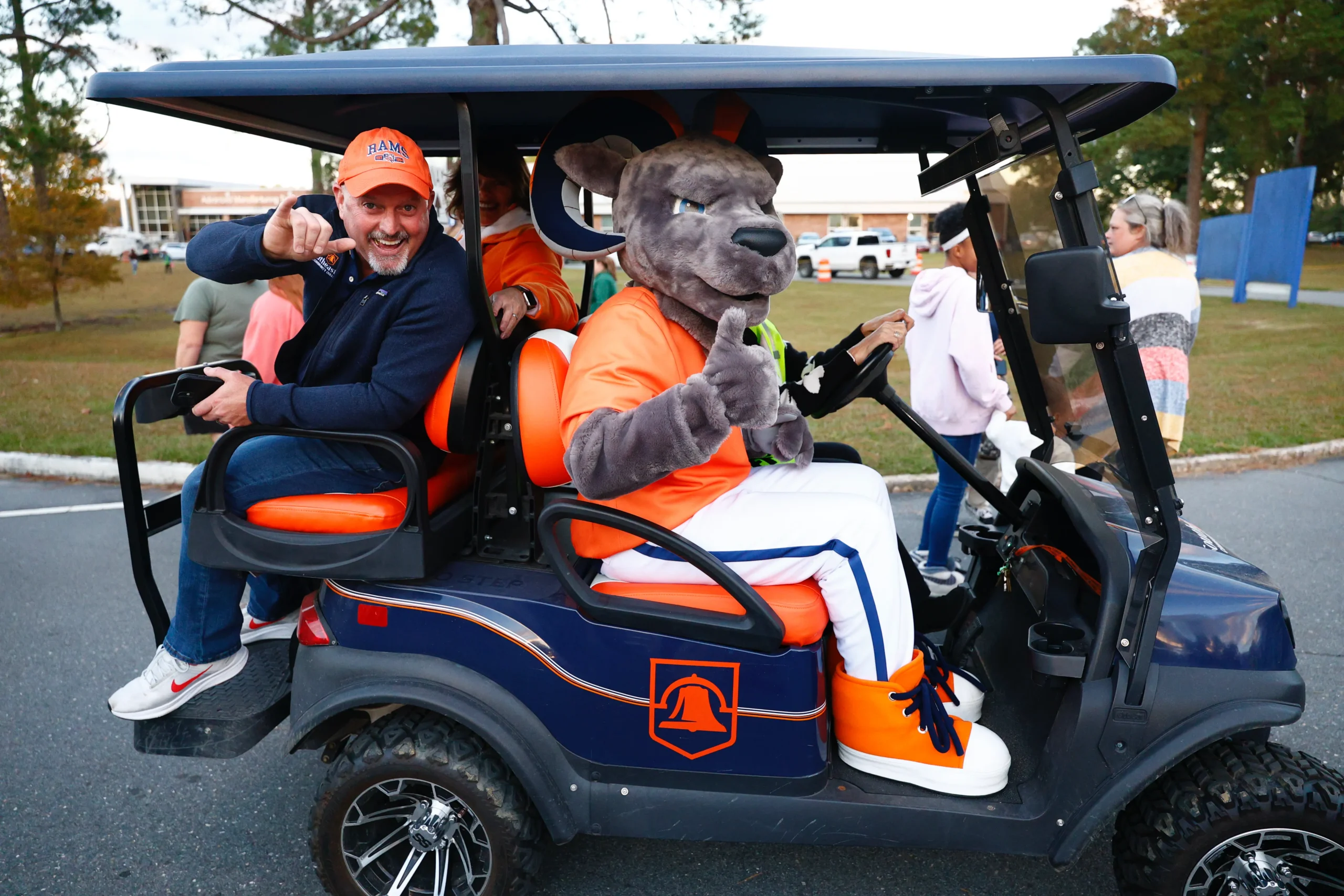 Mascot and President on Golf Cart