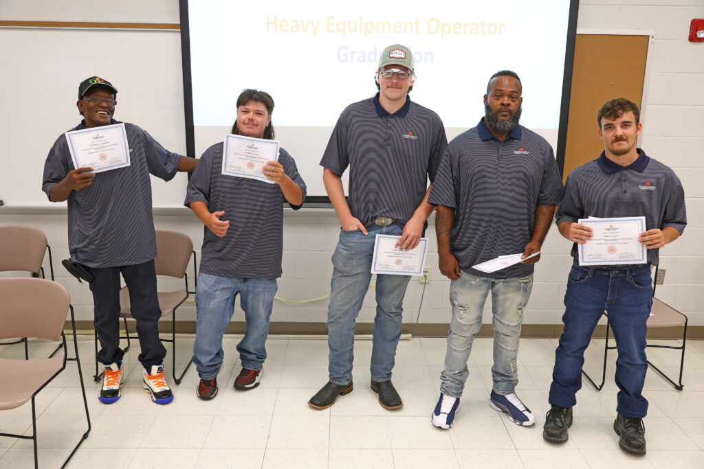 Heavy Equipment Operator graduation - Students standing with their certificates