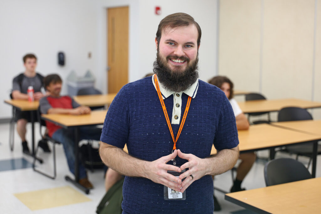 Dr. Matthew Nobles stands in front of his psychology class in Cartrette Building.