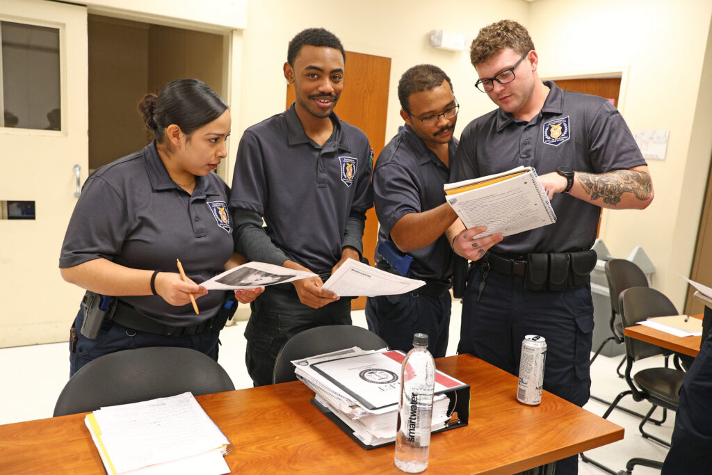 Basic Law Enforcement Training students gather together in a classroom.