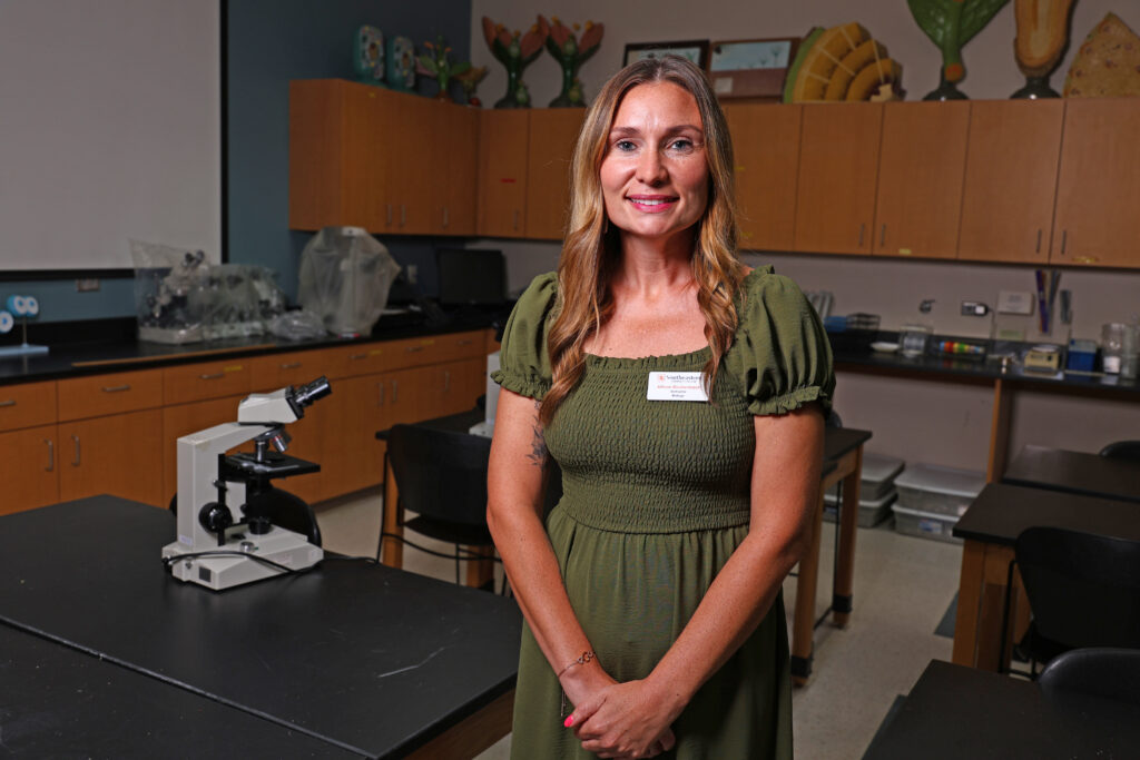 SCC Biology Instructor Allison Rockenbach stands in her classroom.
